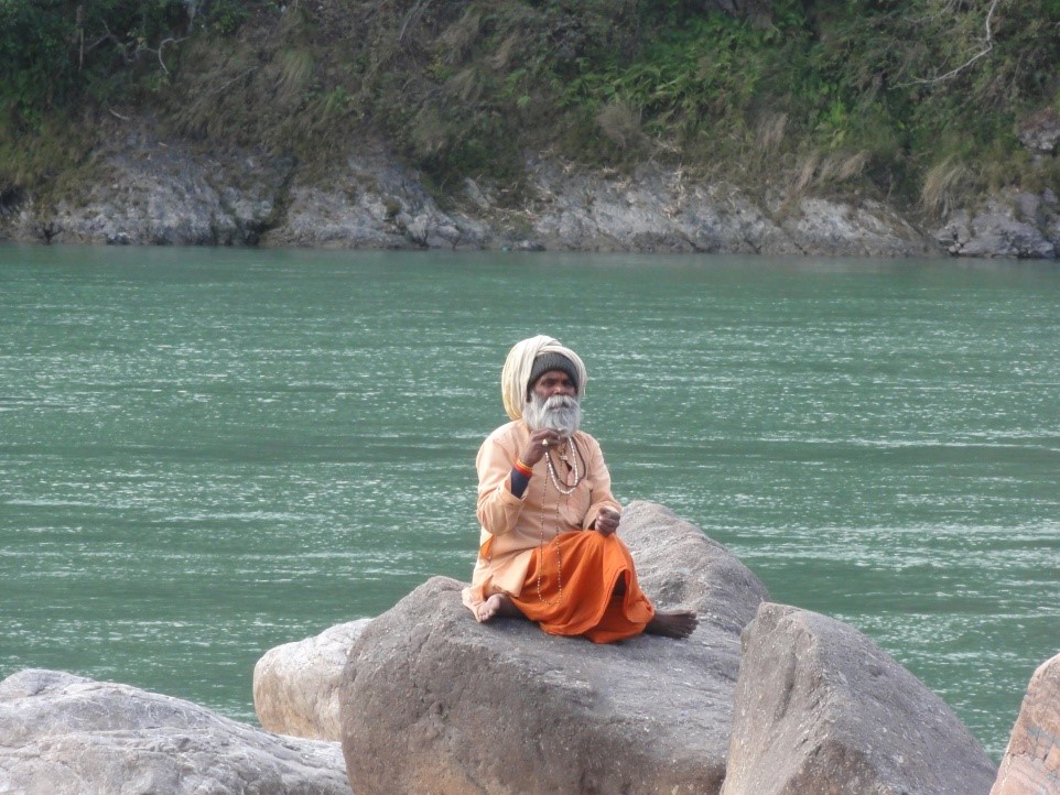 Saint sitting at ganga beach in Rishikesh